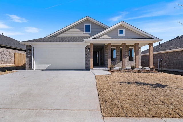 view of front of house with a porch and a garage