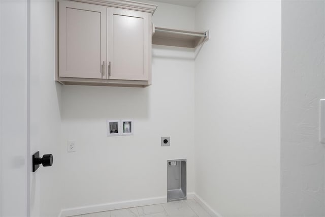 washroom with hookup for an electric dryer, cabinets, and hookup for a washing machine