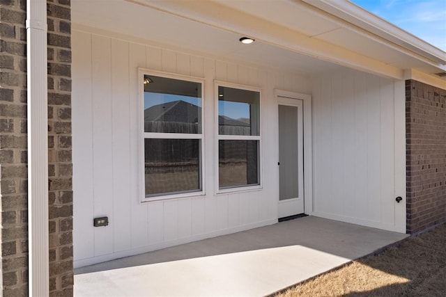 property entrance with a patio area