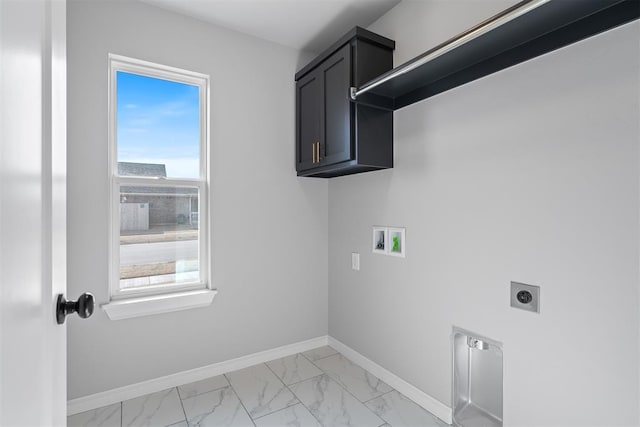 clothes washing area featuring electric dryer hookup, washer hookup, and cabinets