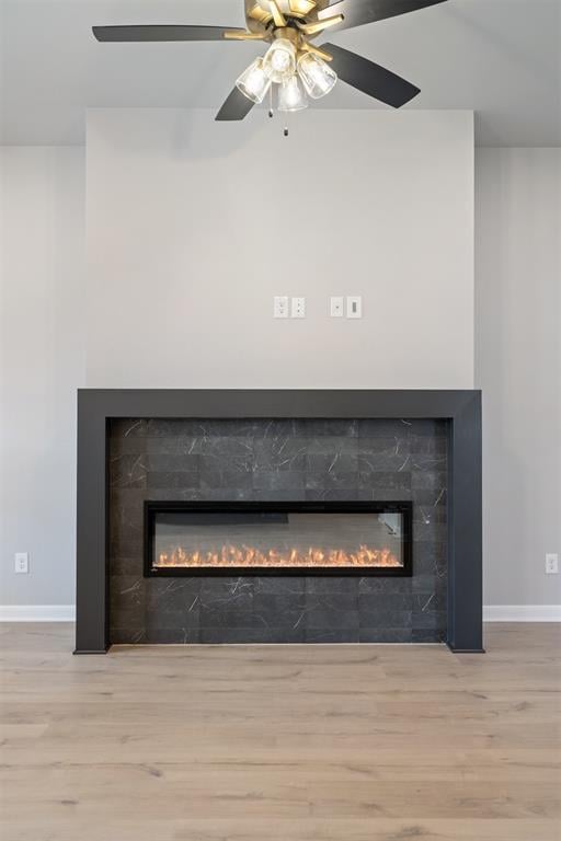 interior details with wood-type flooring and ceiling fan