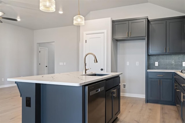 kitchen with pendant lighting, sink, dishwasher, light stone counters, and a center island with sink