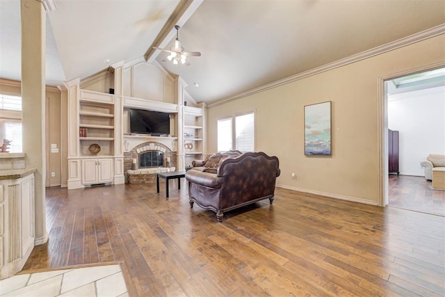 living room with a fireplace, hardwood / wood-style floors, lofted ceiling with beams, and ceiling fan