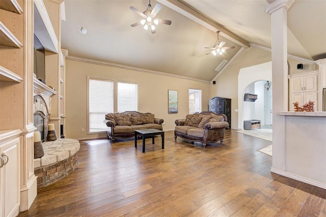 living room with ceiling fan, beam ceiling, high vaulted ceiling, a fireplace, and hardwood / wood-style floors