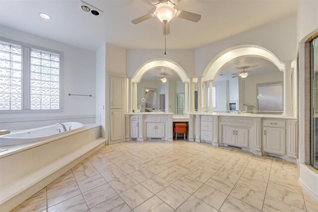 bathroom with vanity, decorative columns, separate shower and tub, and ceiling fan