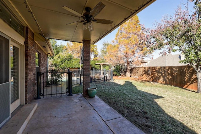 view of patio featuring ceiling fan