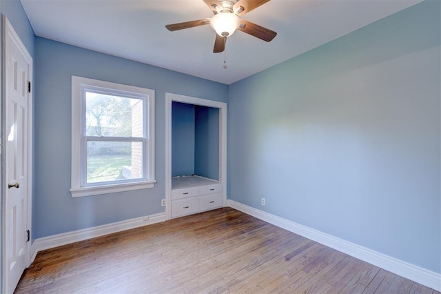 unfurnished bedroom with light wood-type flooring and ceiling fan