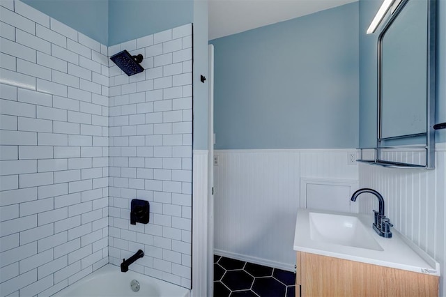 bathroom with vanity and tiled shower / bath combo