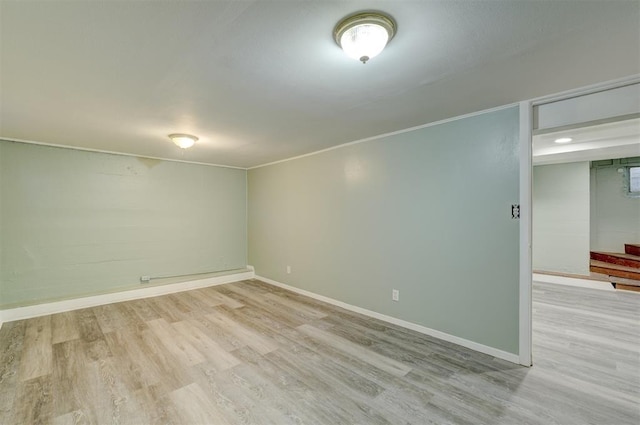 empty room with light hardwood / wood-style flooring