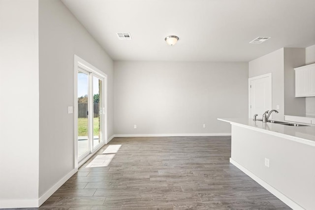 interior space featuring sink and dark wood-type flooring