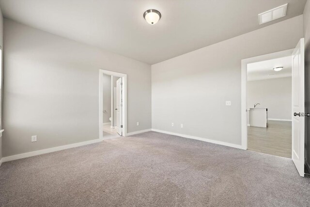 unfurnished room with carpet flooring