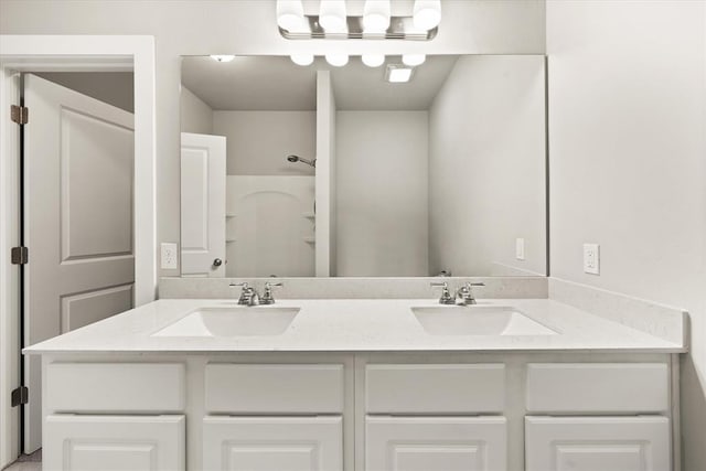 bathroom with vanity and walk in shower