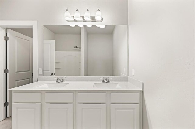 bathroom with vanity and walk in shower