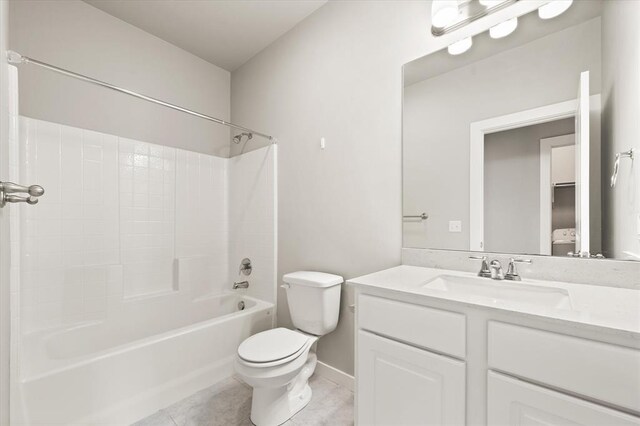 full bathroom featuring tile patterned flooring, vanity, toilet, and shower / washtub combination