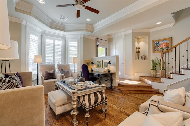 living room with ceiling fan, ornamental molding, and hardwood / wood-style flooring