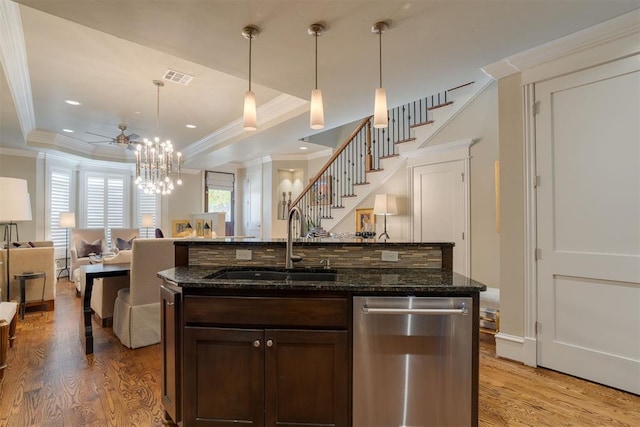 kitchen with dishwasher, dark stone counters, sink, light hardwood / wood-style floors, and dark brown cabinetry