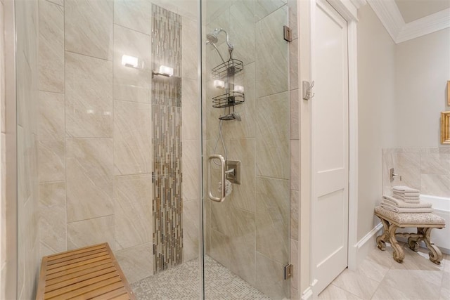 bathroom featuring a shower with shower door and crown molding