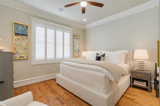 bedroom featuring ceiling fan, crown molding, and light wood-type flooring