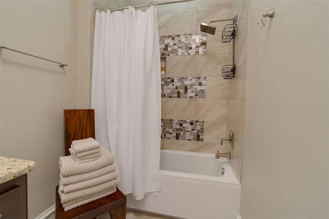 bathroom with vanity and shower / tub combo with curtain