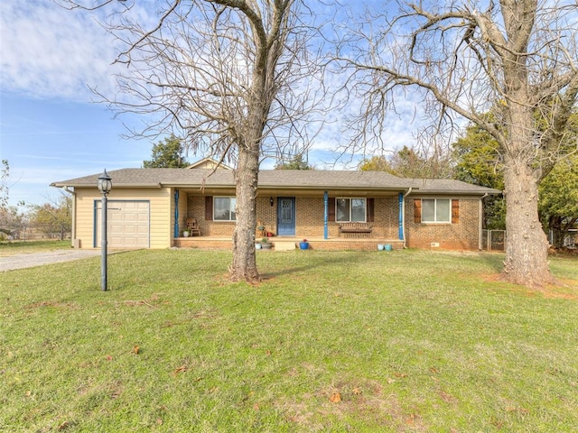 single story home with a garage and a front lawn