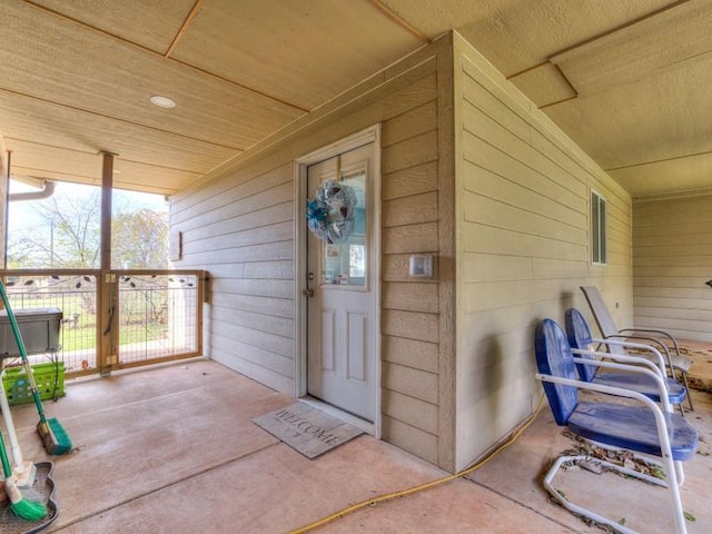 entrance to property with covered porch