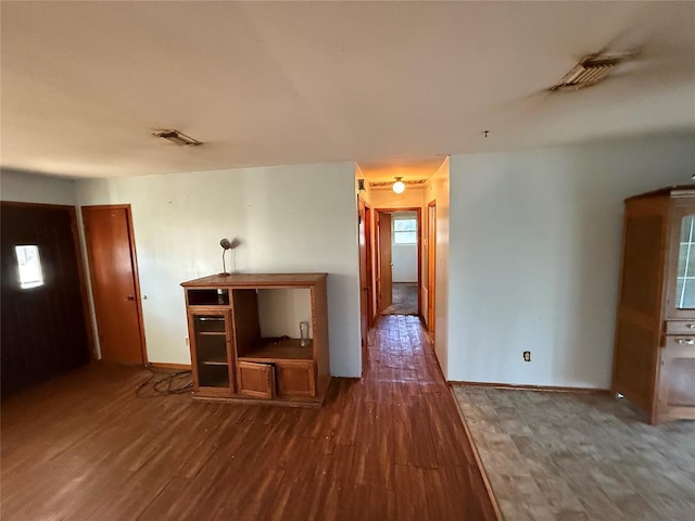 unfurnished room featuring dark hardwood / wood-style floors