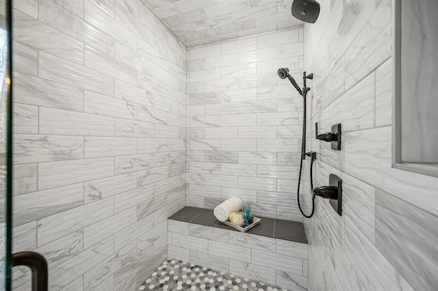 bathroom with tiled shower