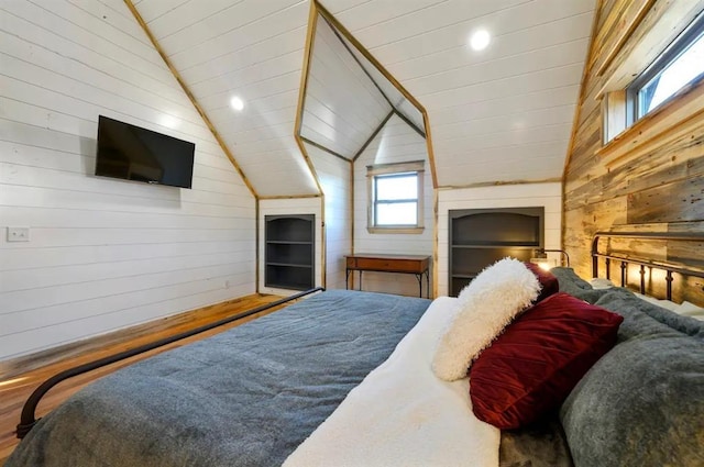 bedroom featuring hardwood / wood-style floors, lofted ceiling, wooden walls, and wood ceiling