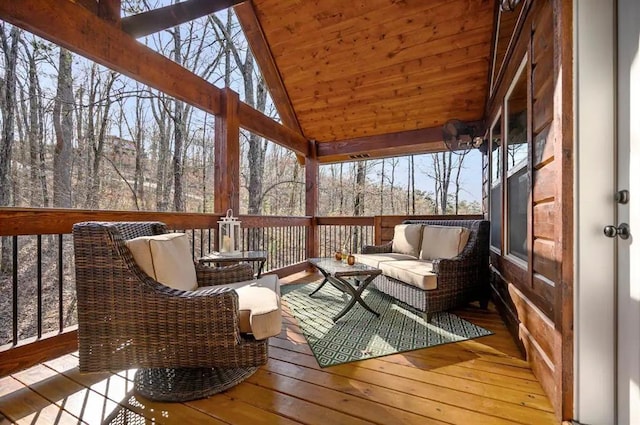 unfurnished sunroom featuring wood ceiling and vaulted ceiling