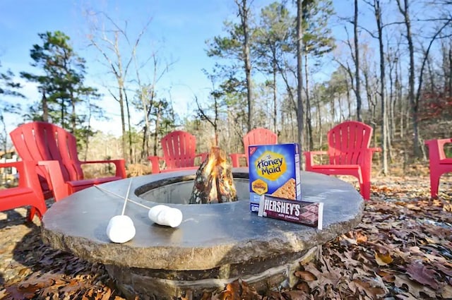 exterior details featuring an outdoor fire pit