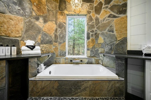 bathroom with tiled tub