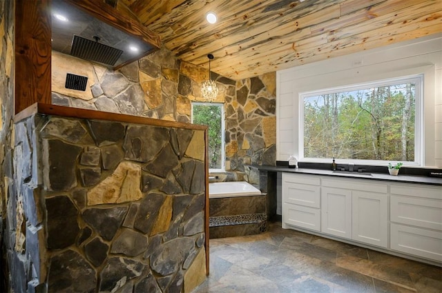 bathroom with wooden ceiling, a notable chandelier, separate shower and tub, wood walls, and vanity