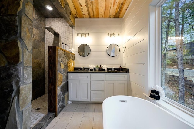 bathroom with vanity, separate shower and tub, wooden ceiling, and a wealth of natural light