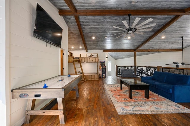 unfurnished living room with vaulted ceiling with beams, ceiling fan, and dark hardwood / wood-style flooring