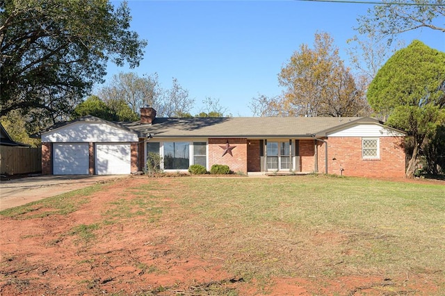 single story home featuring a front lawn and a garage