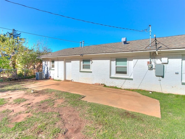 back of property with cooling unit and a patio area