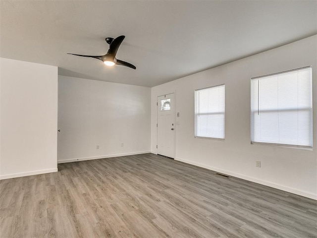 interior space with light hardwood / wood-style floors and ceiling fan