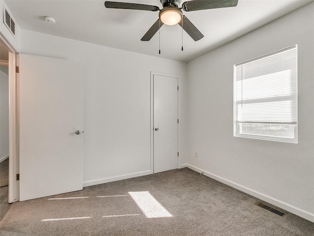 unfurnished bedroom with carpet flooring and ceiling fan