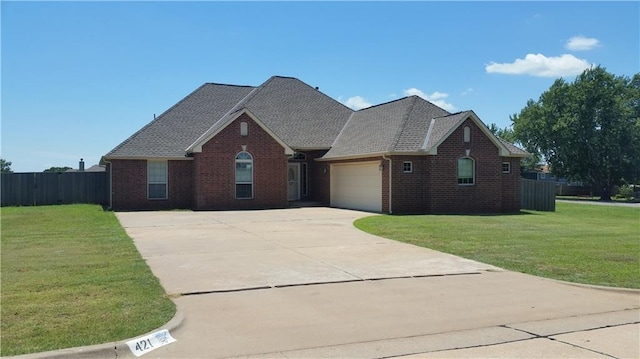 view of front of home featuring a front lawn and a garage