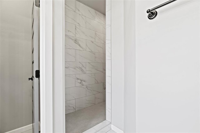 bathroom with a tile shower