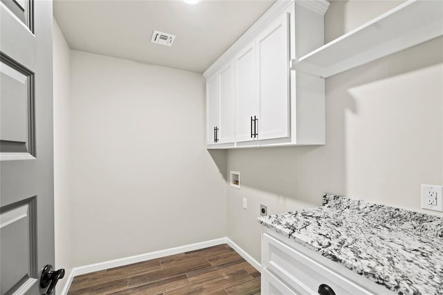 laundry room featuring cabinets, washer hookup, dark hardwood / wood-style floors, and hookup for an electric dryer