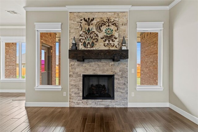 10513 SW 51st St, Mustang, OK 73064 - unfurnished living room with wood finished floors, baseboards, and crown molding