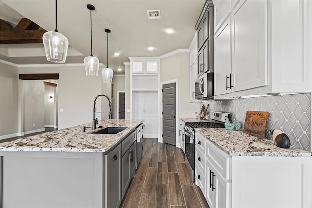 10513 SW 51st St, Mustang, OK 73064 - kitchen with appliances with stainless steel finishes, a sink, tasteful backsplash, dark wood-type flooring, and light stone counters