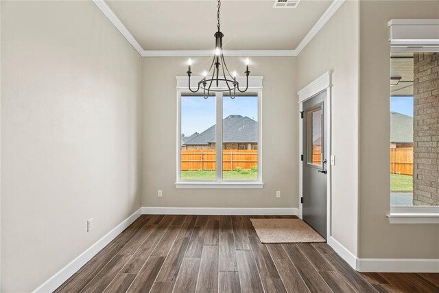 10513 SW 51st St, Mustang, OK 73064 - unfurnished dining area featuring a chandelier, dark wood-style floors, baseboards, and crown molding