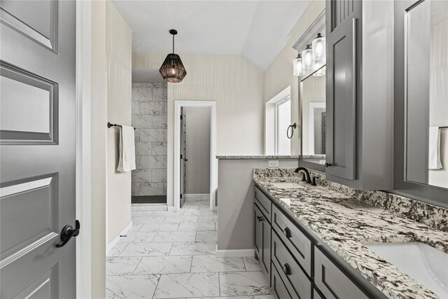10513 SW 51st St, Mustang, OK 73064 - full bath with marble look tiles, double vanity, baseboards, and lofted ceiling