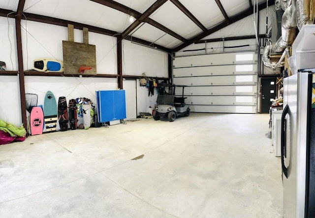 garage with stainless steel fridge