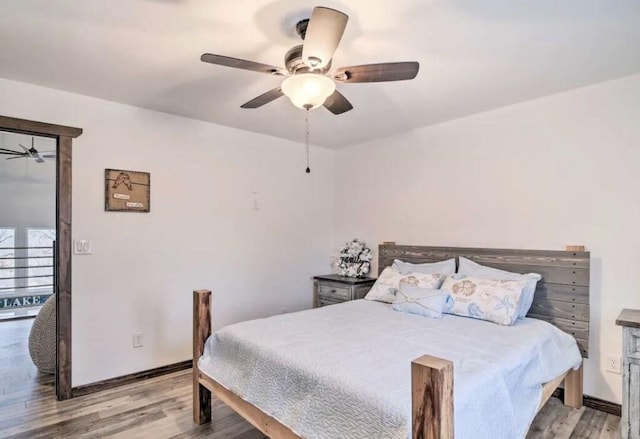 bedroom with ceiling fan and light hardwood / wood-style flooring