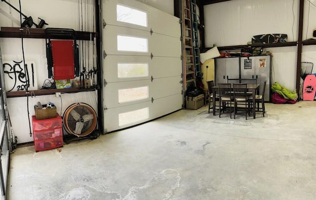 garage featuring stainless steel refrigerator