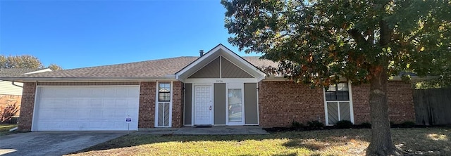 ranch-style house with a garage and a front lawn