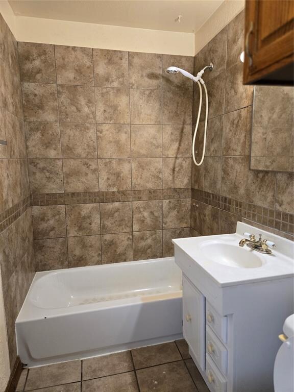 full bathroom with toilet, vanity, washtub / shower combination, and tile patterned floors